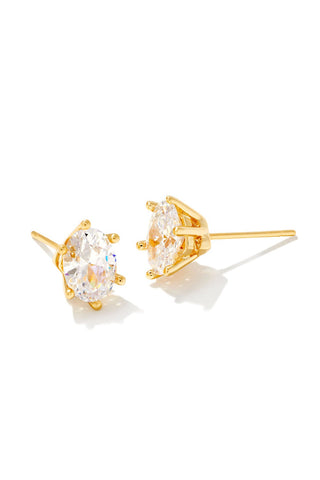 Gold earrings with clear gemstones on a white background