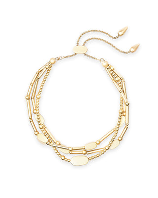 Gold bracelet with multiple chains on a white background