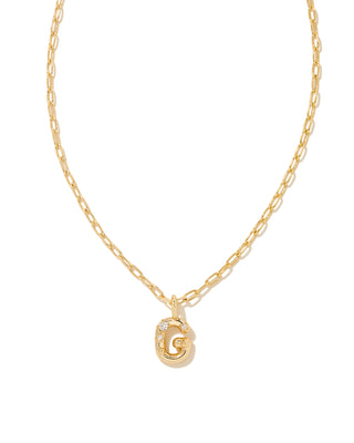 Gold necklace with a letter 'G' pendant on a white background
