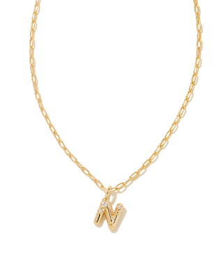 Gold necklace with a 'N' pendant on a white background