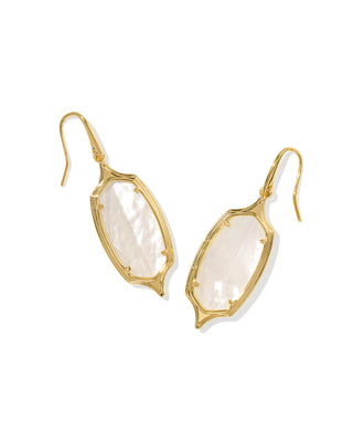 A pair of gold-tone drop earrings featuring organic-shaped white mother-of-pearl stones in a textured bezel setting, shown against a plain white background.