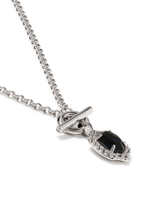 A silver-tone toggle clasp necklace with a teardrop-shaped pendant featuring a dark black center stone surrounded by small clear accent stones, shown on a plain white background.