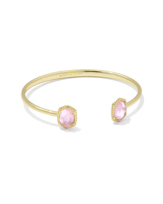 Gold bracelet with pink stones on a white background
