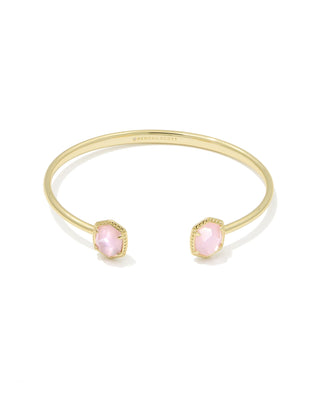 Gold bracelet with pink stones on a white background