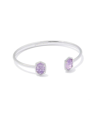 Silver bracelet with purple gemstones on a white background