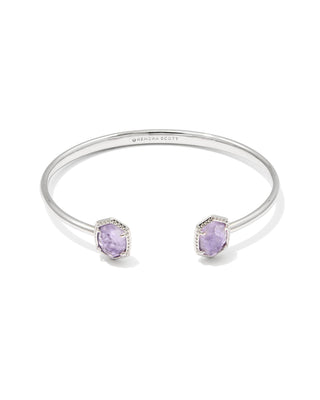 Silver bracelet with purple stones on a white background