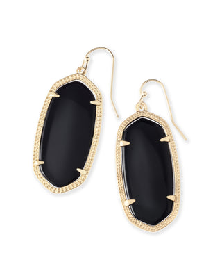 Gold-framed black stone earrings on a white background