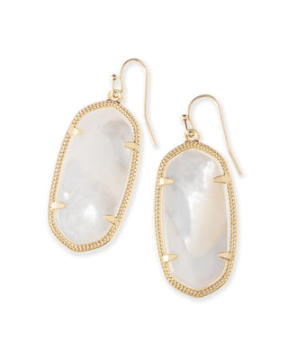 Gold earrings with white stone on a white background