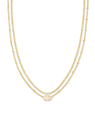 Two gold necklaces on a white background