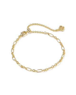 A delicate gold chain anklet with a combination of oval and link chain styles, featuring an adjustable clasp with a small gold flower charm, displayed on a clean white background.