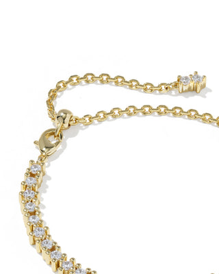 Gold chain anklet with a tennis-style row of clear stones and an adjustable lobster clasp, photographed on a clean white background.