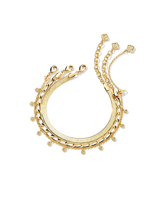 3 gold bracelets on a white background