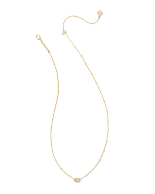 Gold necklace with a small pendant on a white background