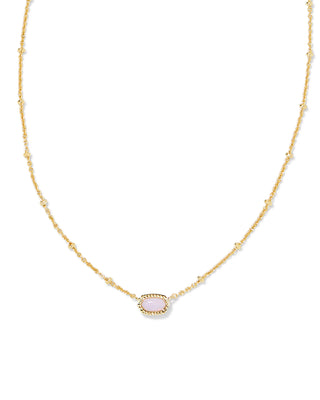Gold necklace with a pink pendant on a white background