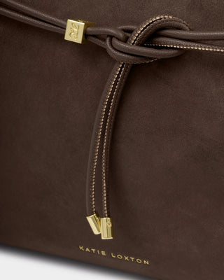 Brown leather bag with drawstring and gold accents, featuring the brand 'Katie Loxton'.
