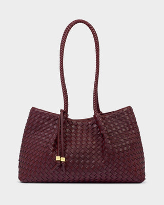 A burgundy woven leather tote bag with braided shoulder straps and a small gold-tone hardware accent, shown against a light gray background.