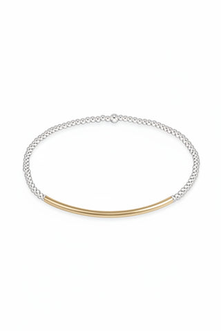 Two-toned bracelet with silver and gold elements on a white background