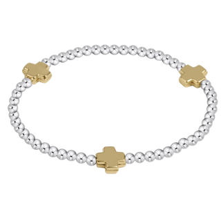 A silver beaded bracelet with three gold cross-shaped charms, displayed on a clean white background.