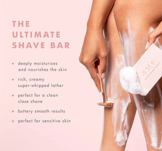 Person shaving with a razor and Ultimate Shave Bar on a pink background