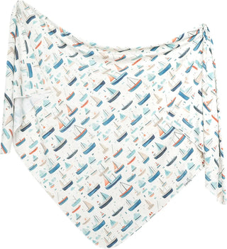 Baby blanket with boat pattern on a white background