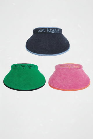 Three colorful visors with text on a white background