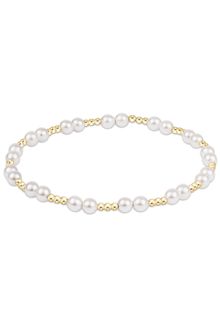 Pearl bracelet with gold accents on a white background