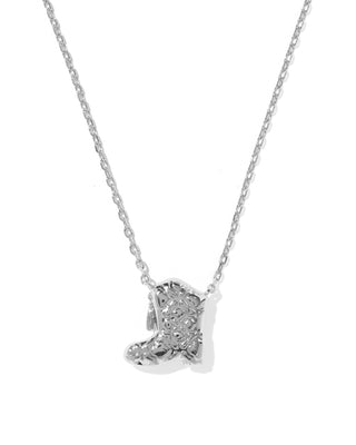 A silver necklace featuring a small boot-shaped pendant paved with clear stones, shown against a plain white background.