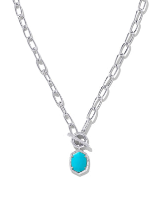 Silver necklace with a turquoise pendant on a white background
