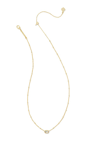 Gold necklace with a small pendant on a white background