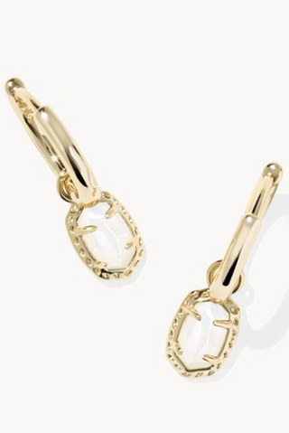 Gold hoop earrings with a small circular design on a white background