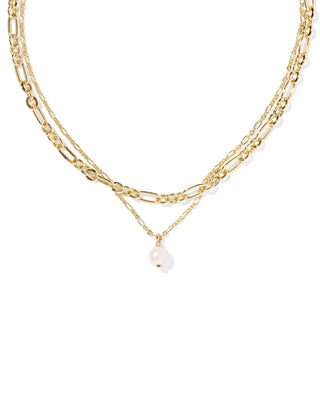 Gold chain necklace with a pearl pendant on a white background